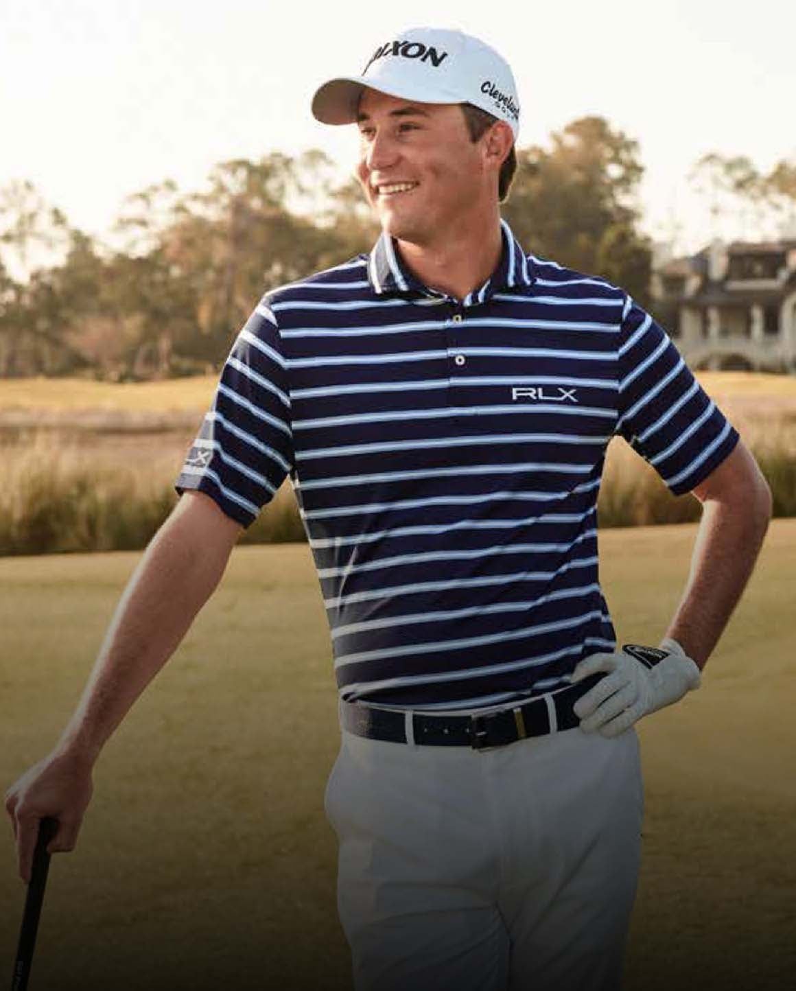 Photo of Smylie Kaufman in striped Polo shirt and white pants.