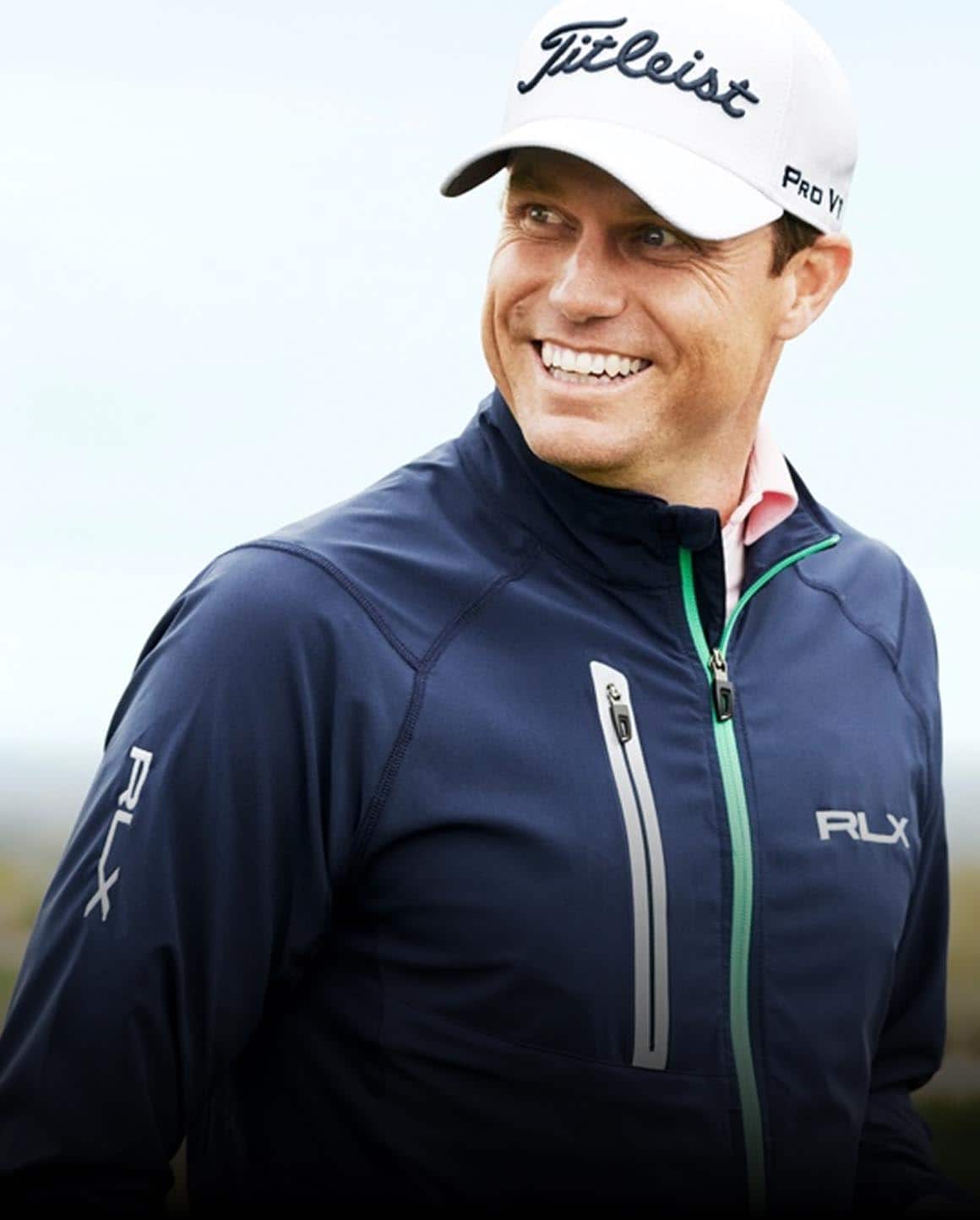 Photo of Nick Watney in navy zip-up RLX jacket.